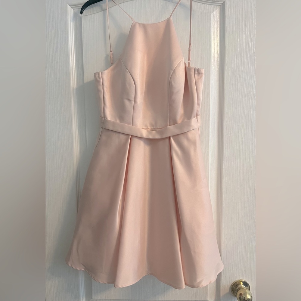 Size 0 super cute light pink mini dress. Halter top, fits according to size